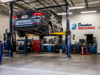 Service bay at Decatur Mechanic with a vehicle on a lift